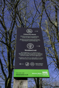 Sign giving directions for 1-mile and 5-mile walking trails around Clatworthy reservoir