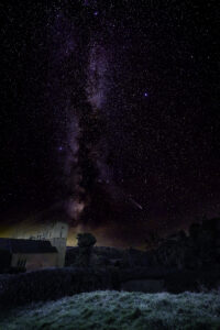 Comet and starry night sky over Raddington church